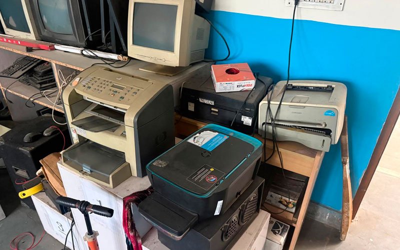 Old desktops and monitors cleared from a corporate IT room
